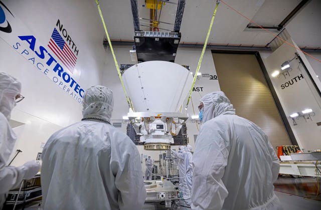 BAE Systems employees working on NASA’s SPHEREx observatory in the Astrotech Space Operations facility at Vandenberg Space Force Base in California