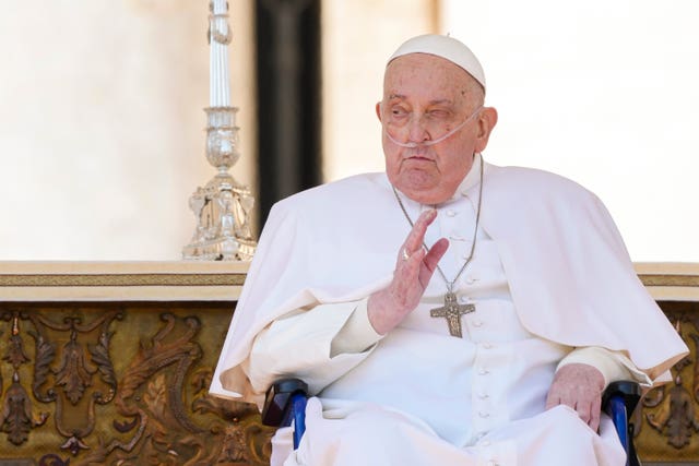 Pope Francis arrives in a wheelchair at the end of a mass in St Peter’s Square at The Vatican on April 6