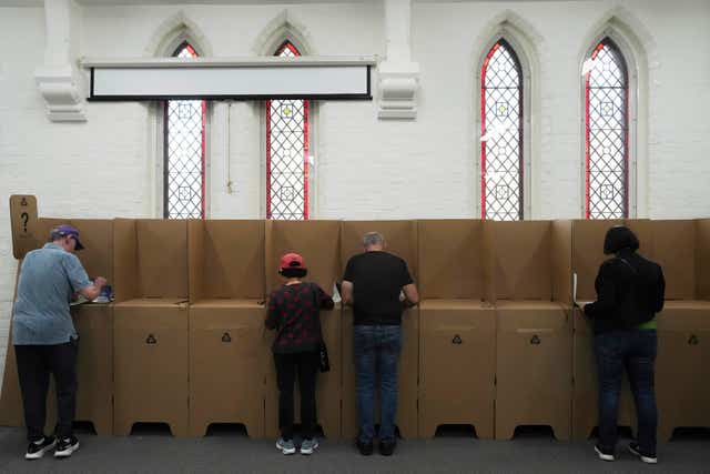 People cast their ballots at a polling station in Sydney