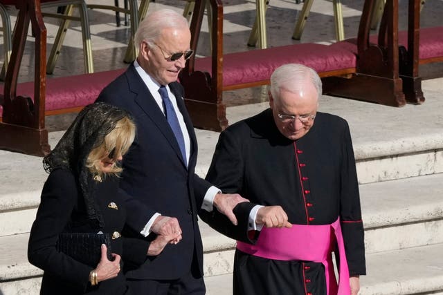 Former president Joe Biden, centre, and his wife Jill arrive for the funeral of Pope Francis