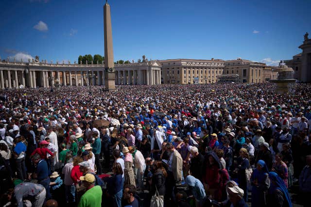 Crowds listen to mass during the funeral of Pope Francis in St Peter’s Square