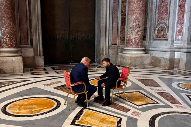 Ukraine’s President Volodymyr Zelensky, right, sitting talking to US President Donald Trump
