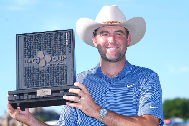 Scottie Scheffler holds the CJ Cup Byron Nelson trophy