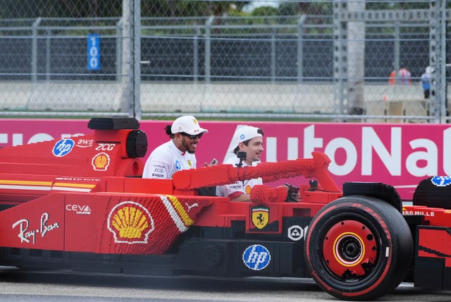 Ferrari drivers in LEGO car