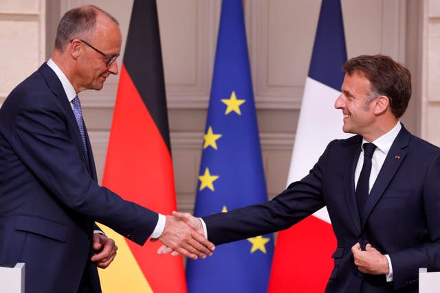 German chancellor Friedrich Merz, left, and French president Emmanuel Macron shake hands
