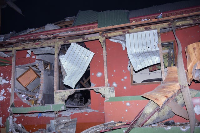 A damage portion of a building is seen at a site of a suspected Indian missile attack near Muzaffarabad, the capital of Pakistan controlled Kashmir