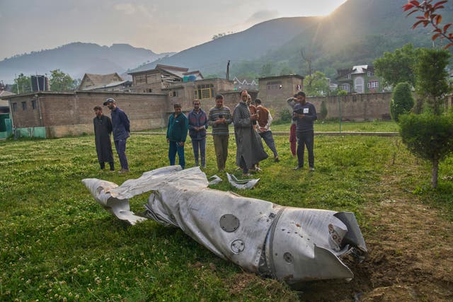 Debris of an aircraft lie in the compound of a mosque at Pampore in Pulwama district of Indian controlled Kashmir