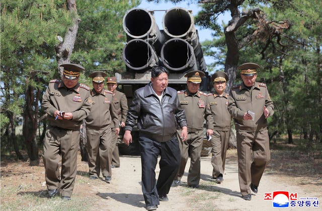 In this photo provided by the North Korean government, North Korean leader Kim Jong Un, centre, supervises a drill of long-range artillery and missile systems at North Korea’s eastern coast