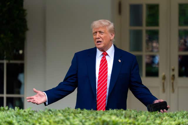 President Donald Trump speaks with reporters in front of the West Wing of the White House in Washington