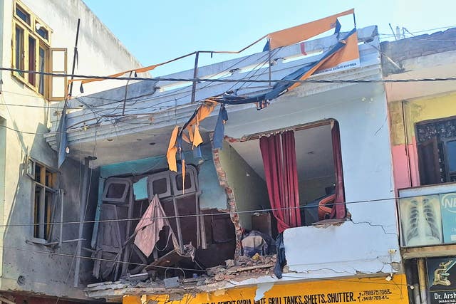 A residence, damaged by a Pakistan shelling, is seen in Rajouri, along the Line of Control, India