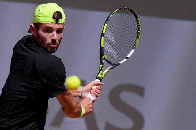 Jacob Fearnley hits a backhand in Rome