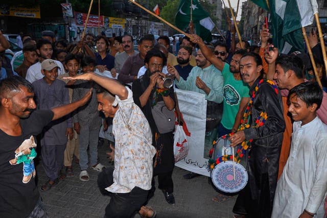 Men dancing and celebrating on the street