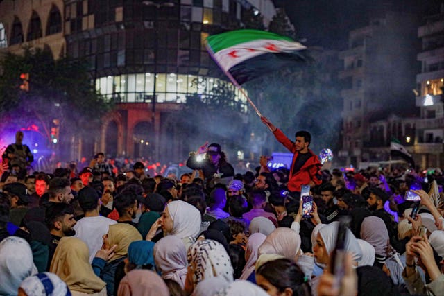 Syrians in Homs celebrate after US President Donald Trump announced plans during his visit to Saudi Arabia to ease sanctions on Syria and normalise relations with its new government