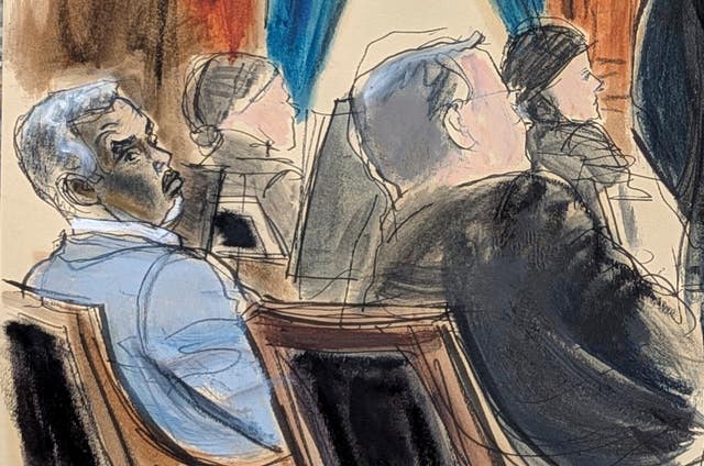 Sean 'Diddy' Combs, far left, and lawyer Marc Agnifilo, right, sit at the defence table in Manhattan federal court in New York