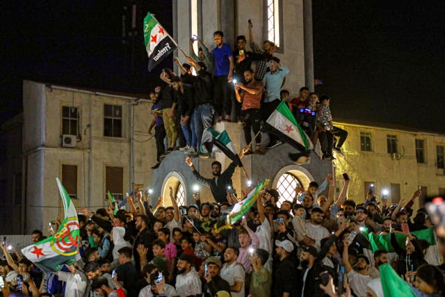 Syrians in Homs celebrate after US President Donald Trump announced plans during his visit to Saudi Arabia to ease sanctions on Syria and normalise relations with its new government