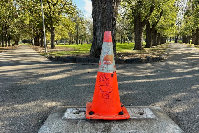 A traffic cone sits where a monument of British explorer Captain James Cook once stood before it was removed following continued vandalism at a park Melbourne, Australia
