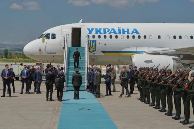 Ukrainian president Volodymyr Zelensky walks down the stairs from his plane upon his arrival at Esenboga airport in Ankara, Turkey