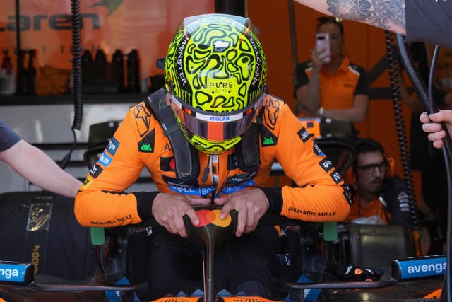 Lando Norris climbs into his McLaren