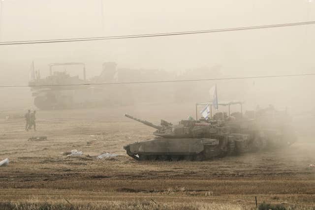 Israeli tanks parked in a staging area in southern Israel