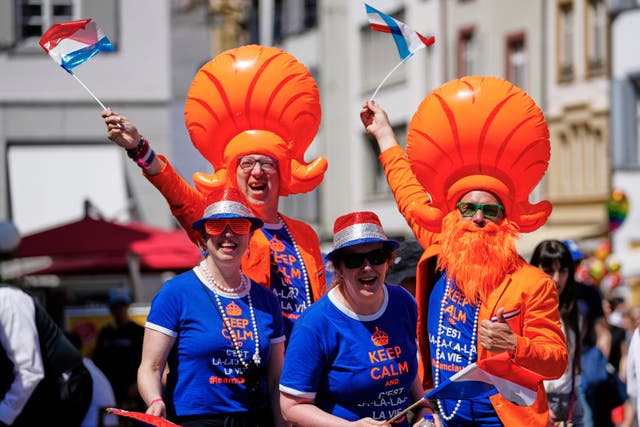 Dutch Eurovision fans wave their flags in the city centre ahead of the Grand Final of the 69th Eurovision Song Contest in Basel, Switzerland
