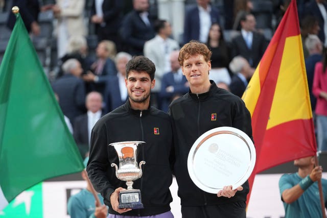 Carlos Alcaraz of Spain, left, and Jannik Sinner of Italy pose for the photographer