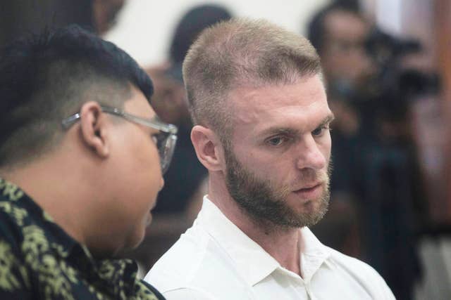 Thomas Parker listens to his interpreter during his trial hearing