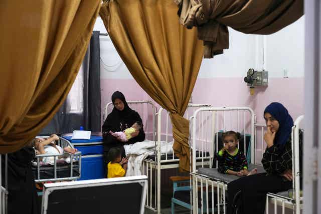 Babies with their mothers in a clinic suffering from malnutrition