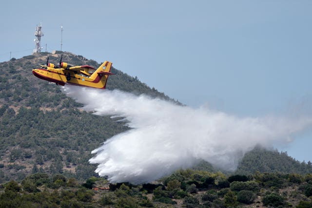 A firefighter plane drops water