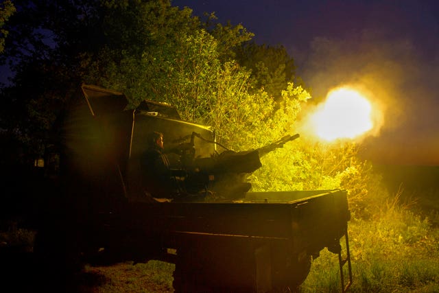 Soldiers fire during Russian drones attacks near Kharkiv