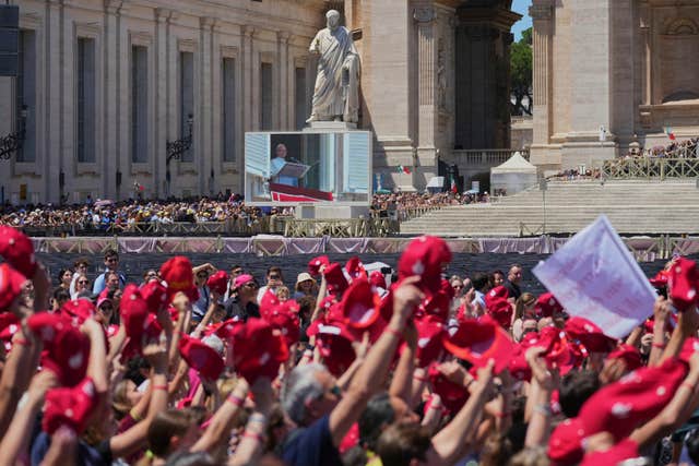 People cheer as Pope appears on big screen