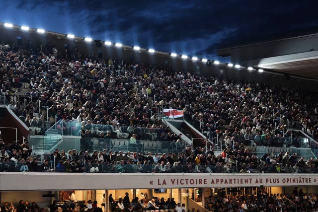 Tennis fans watch the night session at Roland Garros