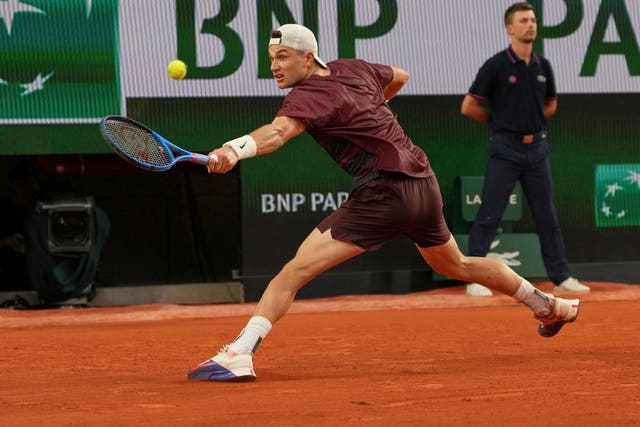 Jack Draper slides on the clay as he hits a backhand