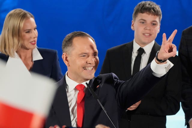 Presidential candidate Karol Nawrocki greets supporters