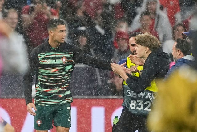 A fan confronts Cristiano Ronaldo before kick-off