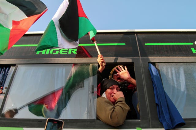 A woman reacts as she rides in a bus, part of a convoy made up of activists, lawyers and medical professionals from North Africa, departing from Tunisia to Gaza to break Israel’s blockade on the territory,