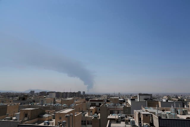 Smoke rises up from an oil facility after a Saturday explosion in southern Tehran, Iran