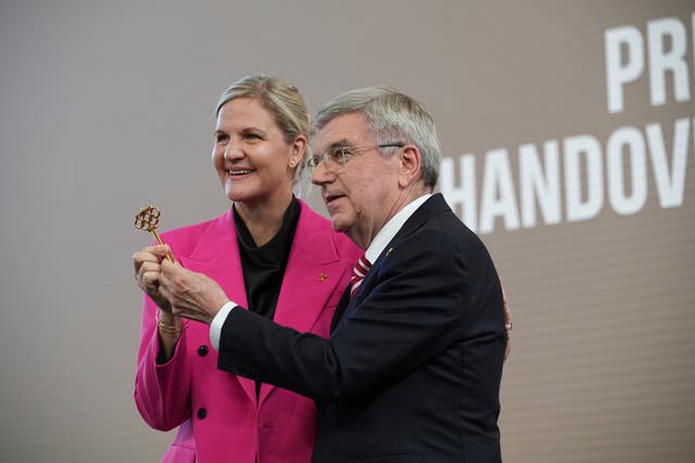 Thomas Bach (right) and his successor as IOC president Kirsty Coventry