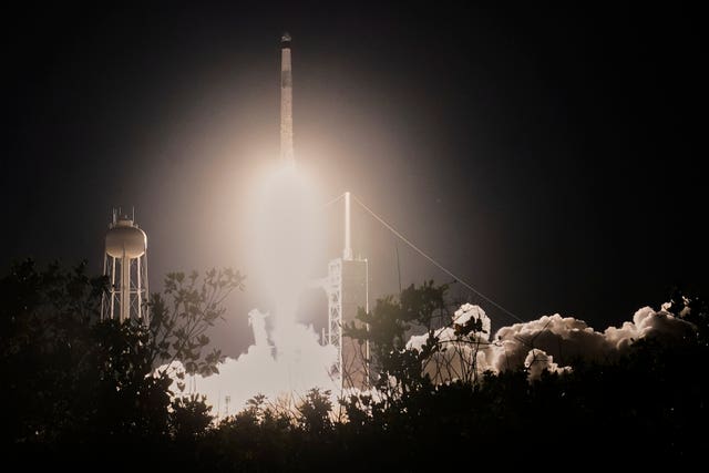 A SpaceX Falcon 9 rocket with a crew of four aboard a Dragon Spacecraft lifts off from pad 39A at the Kennedy Space Centre in Cape Canaveral, Florida