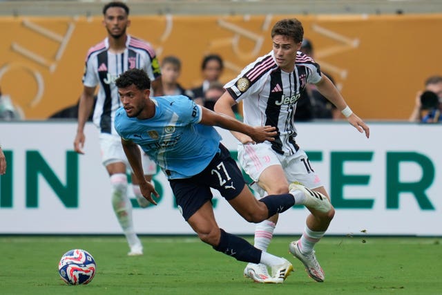 Manchester City's Matheus Nunes, left, and Juventus' Kenan Yildiz