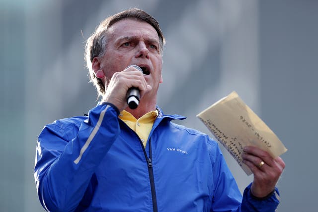 Jair Bolsonaro speaks during a protest against his Supreme Court trial