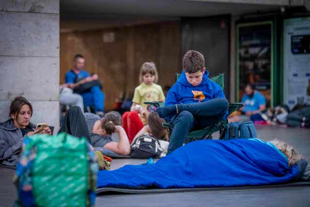 People hide in a metro station,