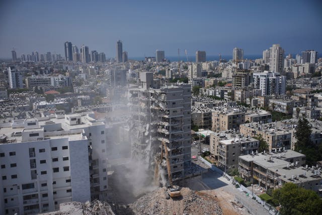 A building that was struck by an Iranian missile during the 12-day Israel-Iran war last month, is demolished in Bat Yam, Israel