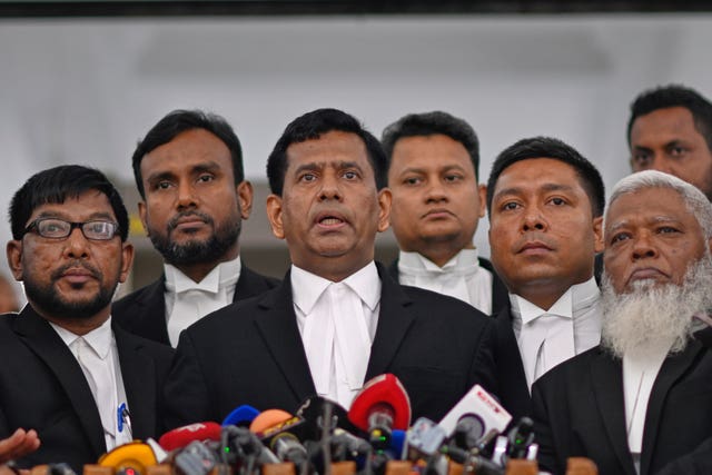 Chief prosecutor Mohammad Tajul Islam, centre, speaks to the media after a special tribunal indicted Bangladesh’s ousted prime minister Sheikh Hasina by accepting charges of crimes against humanity filed against her at the International Crimes Tribunal in Dhaka, Bangladesh
