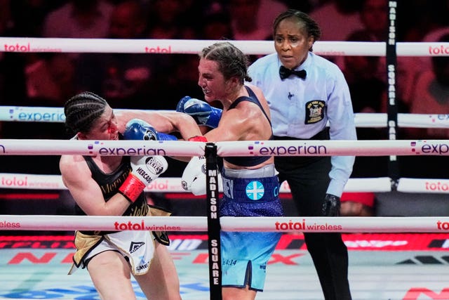 England’s Ellie Scotney, left, punches Mexico’s Yamileth Mercado during the eighth round of their super bantamweight boxing bou
