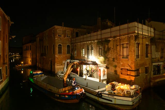 Banksy's The Migrant Child is removed from the facade of Palazzo San Pantalon in Venice