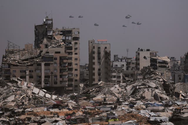 Humanitarian aid is airdropped to Palestinians over Gaza City