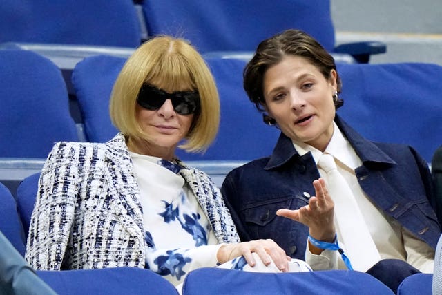 Anna Wintour, left, watches a match at the US Open