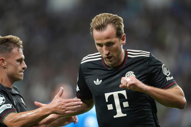 Bayern’s Harry Kane, right, celebrates after scoring the opening goal against Pafos