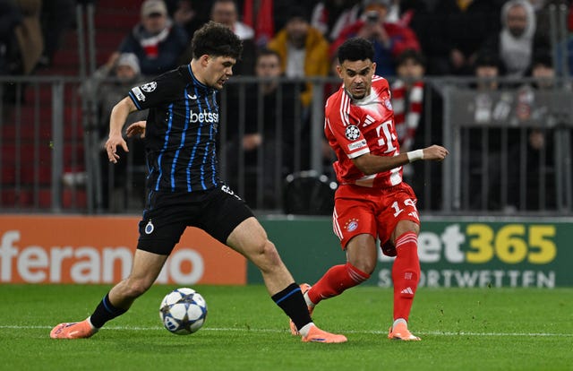 Club Brugges’ Kyriani Sabbe, left, and Bayern Munich’s Luis Diaz in action