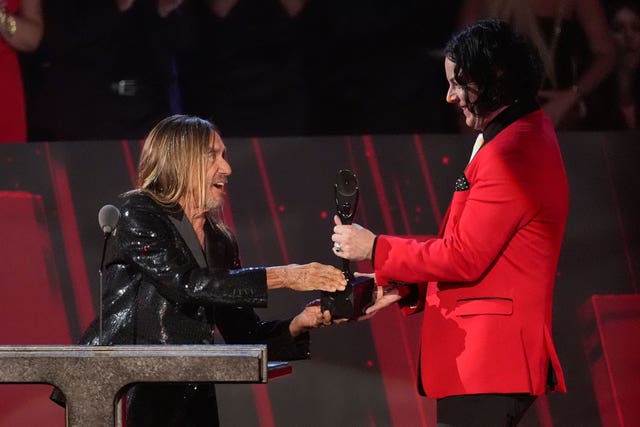 Iggy Pop, left, and inductee Jack White of The White Stripes react during the 2025 Rock and Roll Hall of Fame Induction Ceremony